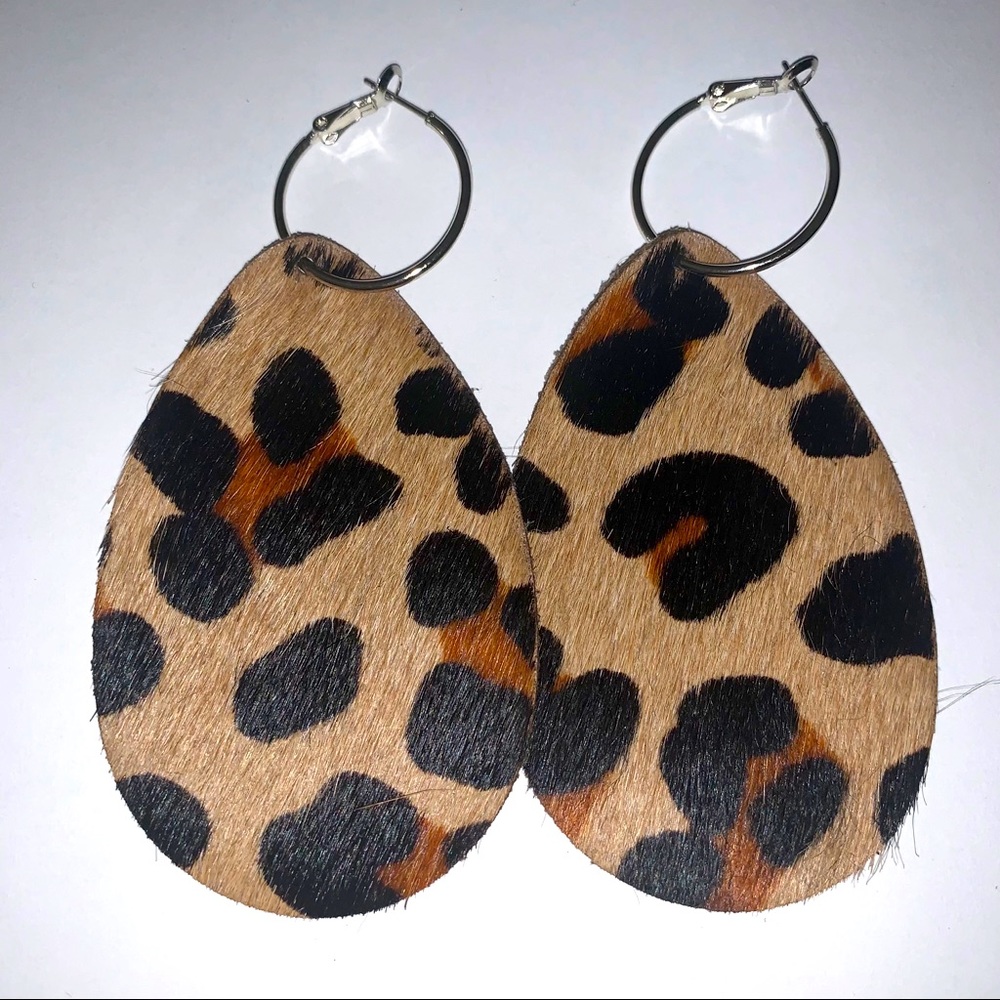 Upcycled cowhide earrings.